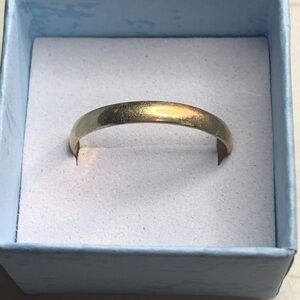 10K Gold Band Ring. 1.85 grams
Size 11 1/2